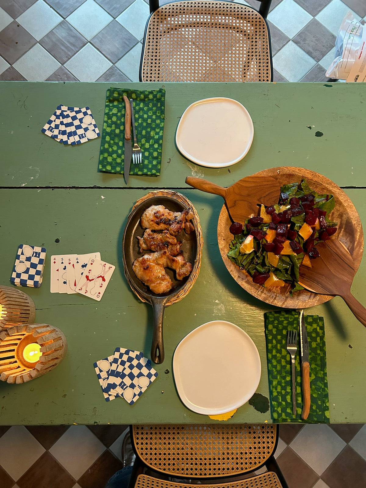A dinner table set with CANDID cards